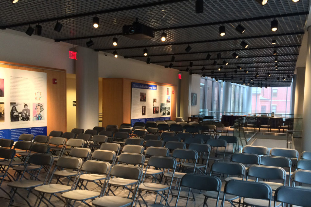 Rows of silver folding chairs set up facing front