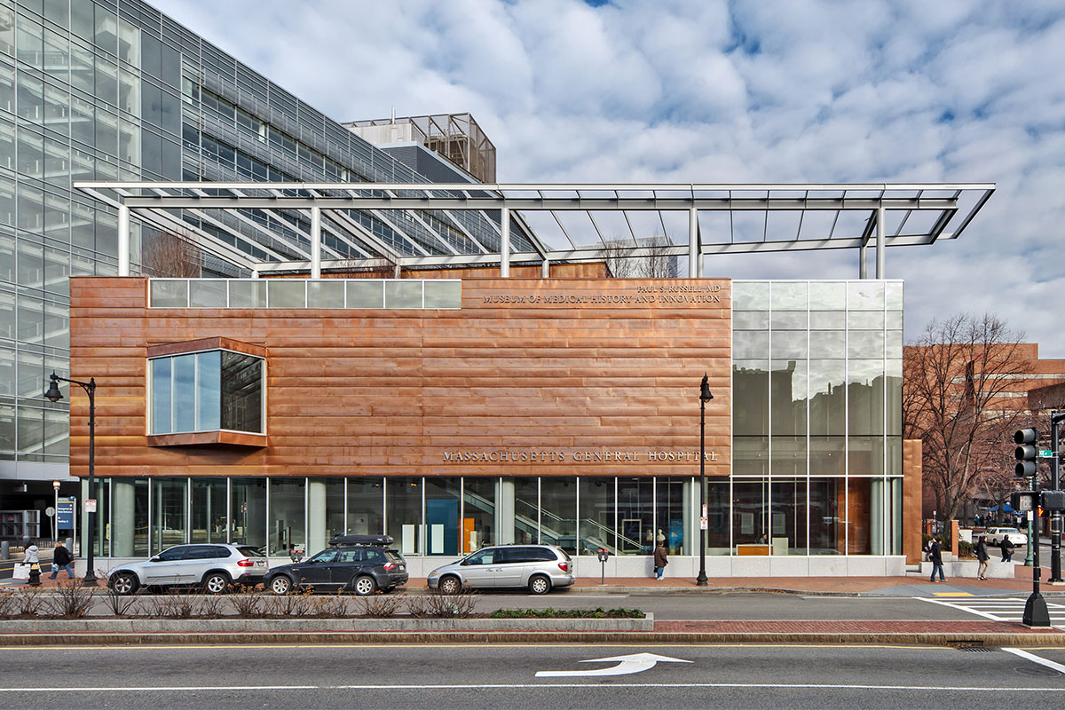 Exterior street view of copper and glass MGH museum building in day