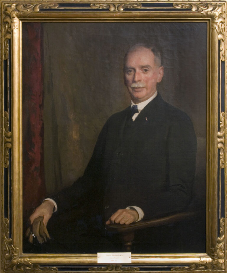 oil painting of a seated man in a suit. The man has gray hair and a mustache