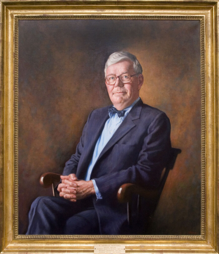 painting of white-haired, seated man, wearing glasses, a gray suit, and a bow tie.