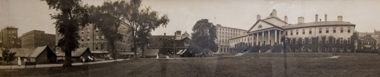 panoramic black & white photo of MGH campus with Bulfinch building on the right and tents on the left
