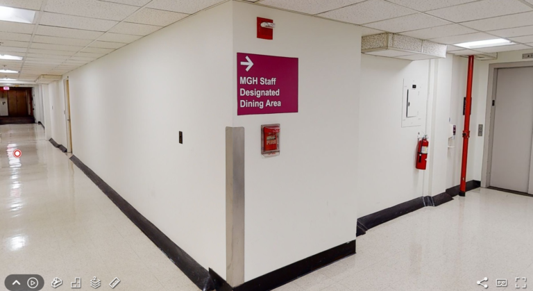 Screenshot of sign reading "MGH Staff Designated Seating Area" in MGH hallway